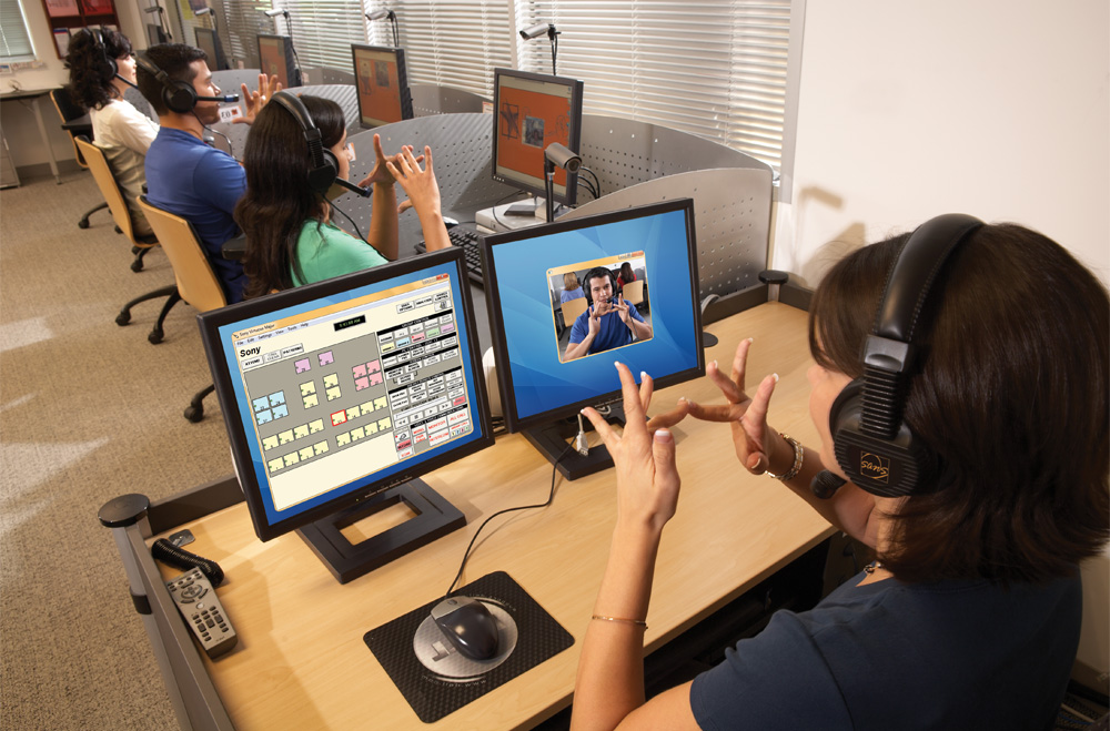 Teacher instructing students on American Sign Language using Virtuoso ASL language lab software